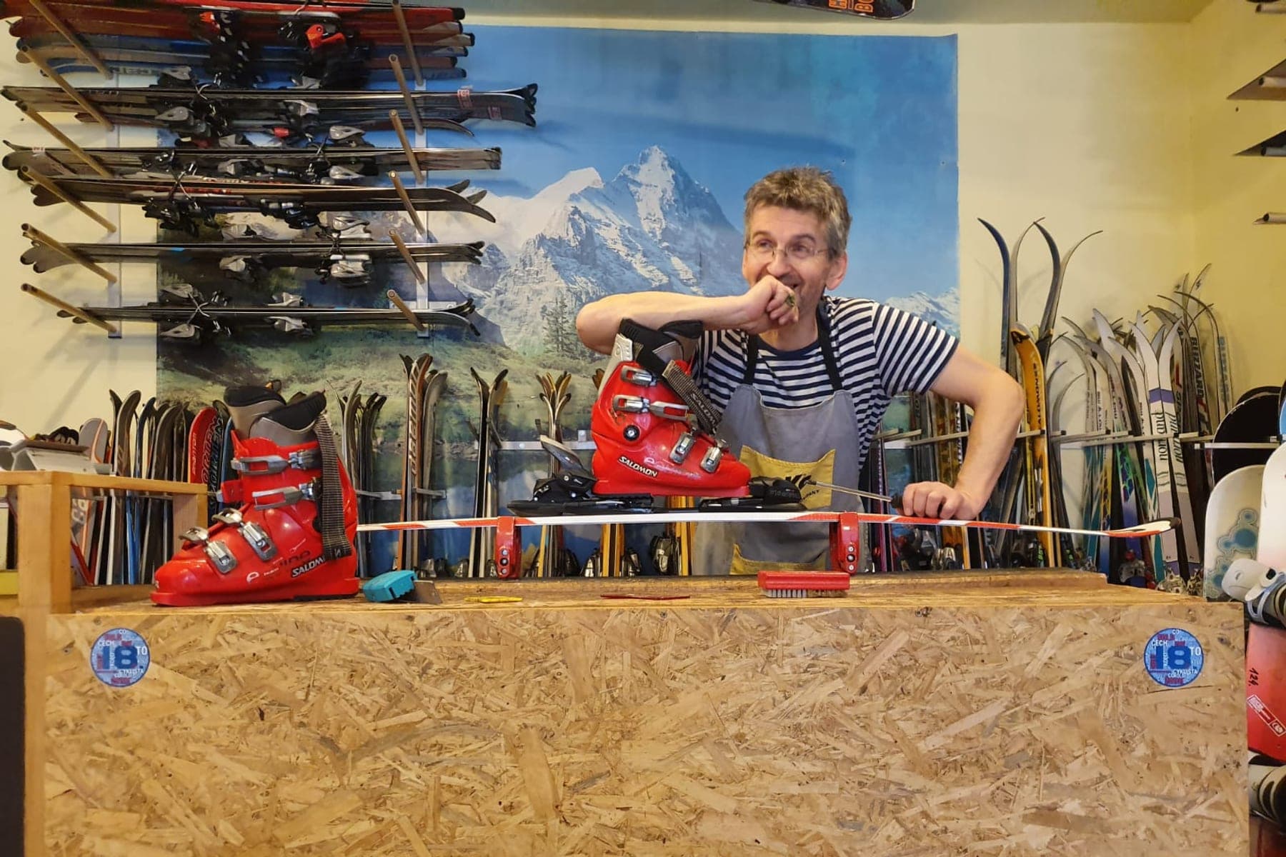 Jiří Honců in his ski rental shop in Vrchlabí, surrounded by racks of skis and ski boots